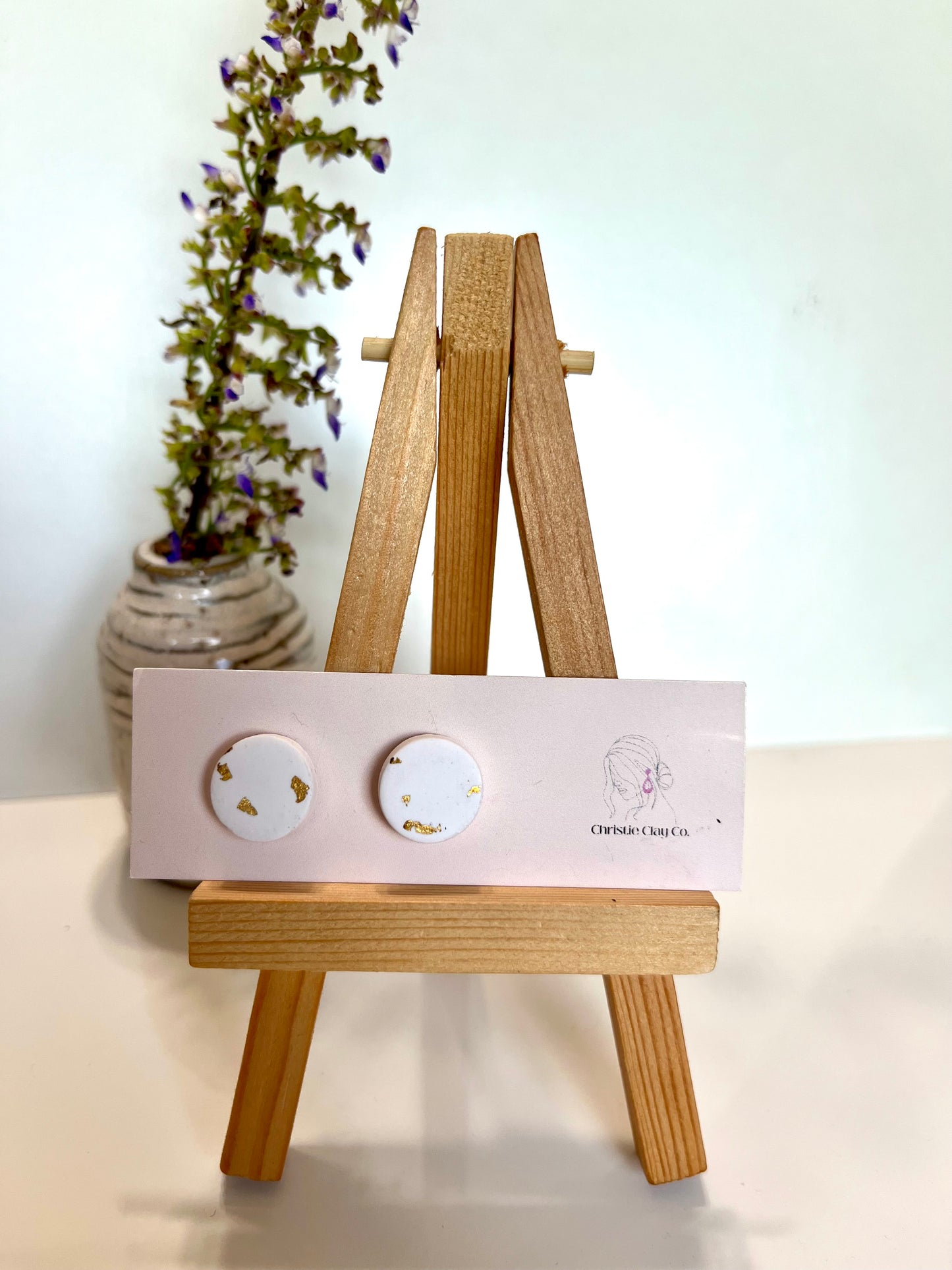 White circle studs with gold foil