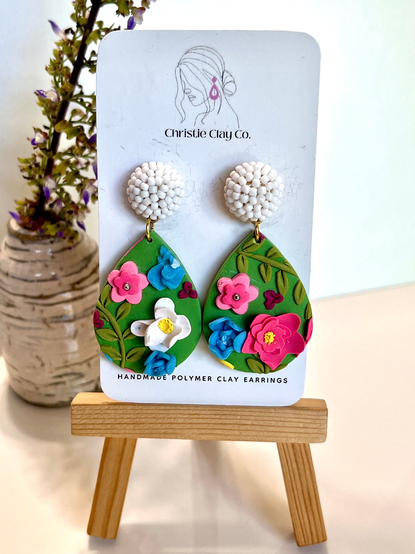 Teardrop with floral design and white beaded finding