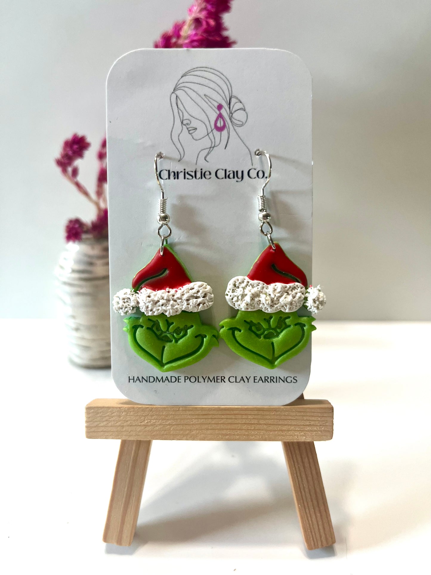 Christmas-Green meanie wearing Santa hat