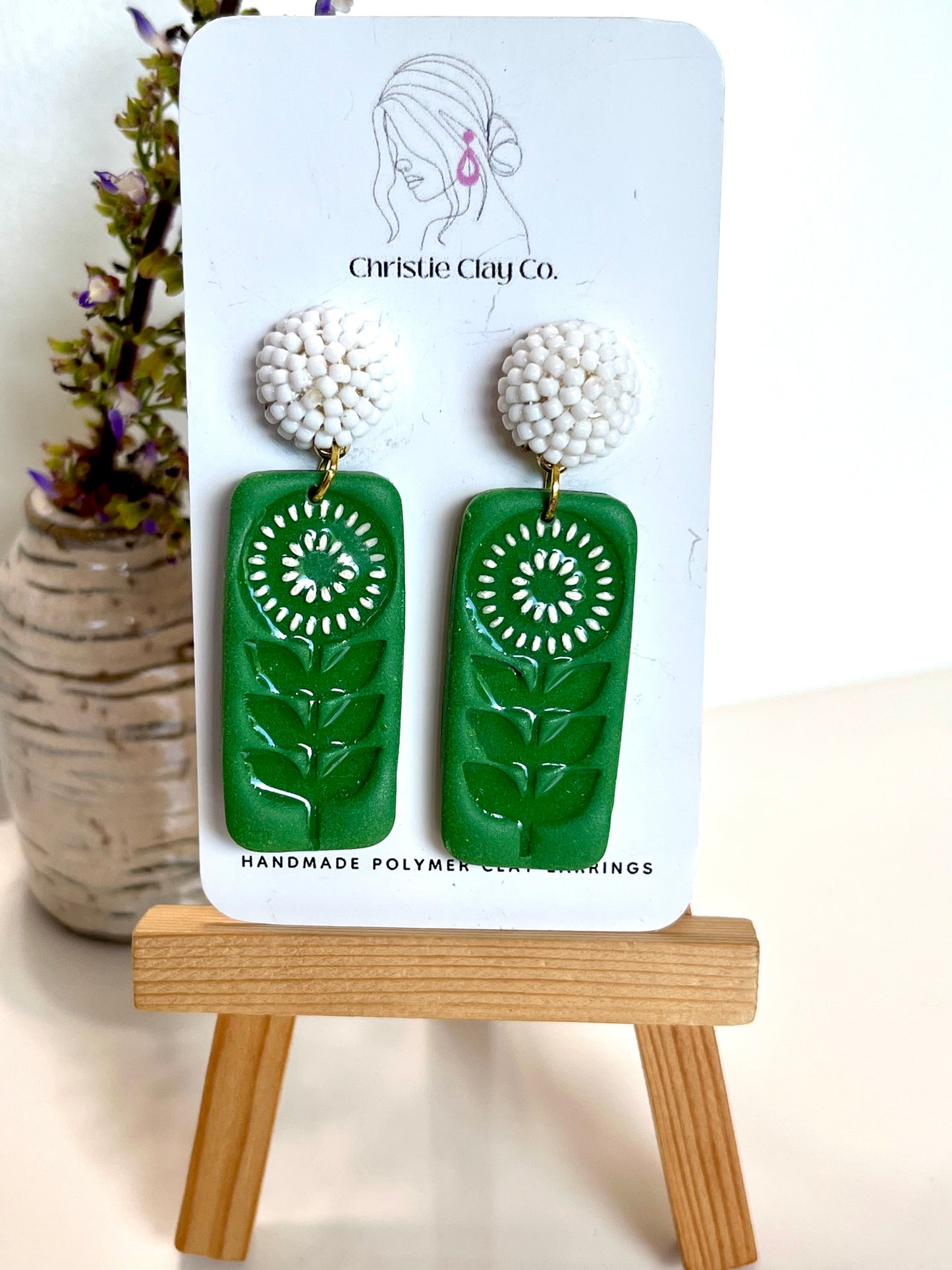 Green floral imprint with white beaded finding