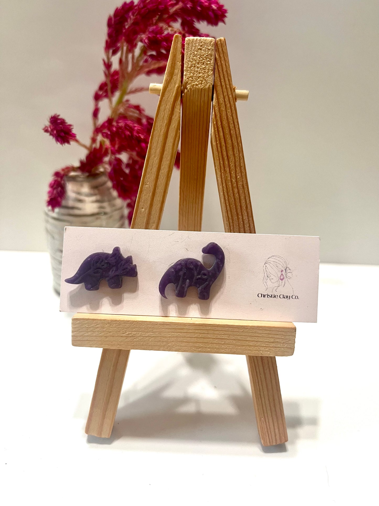 Dinos-Dark purple studs with imprint