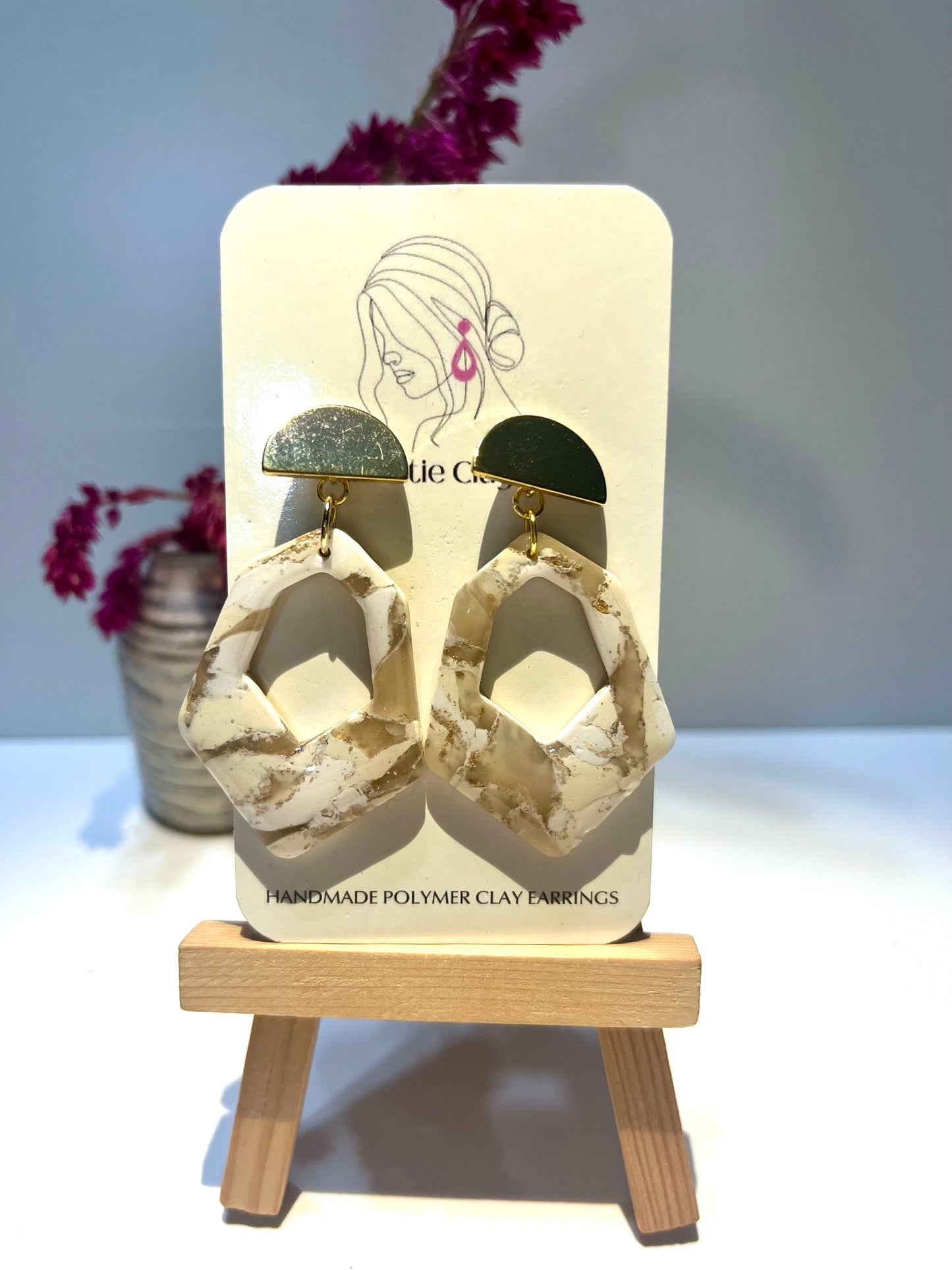 Cream marble cutout with gold finding