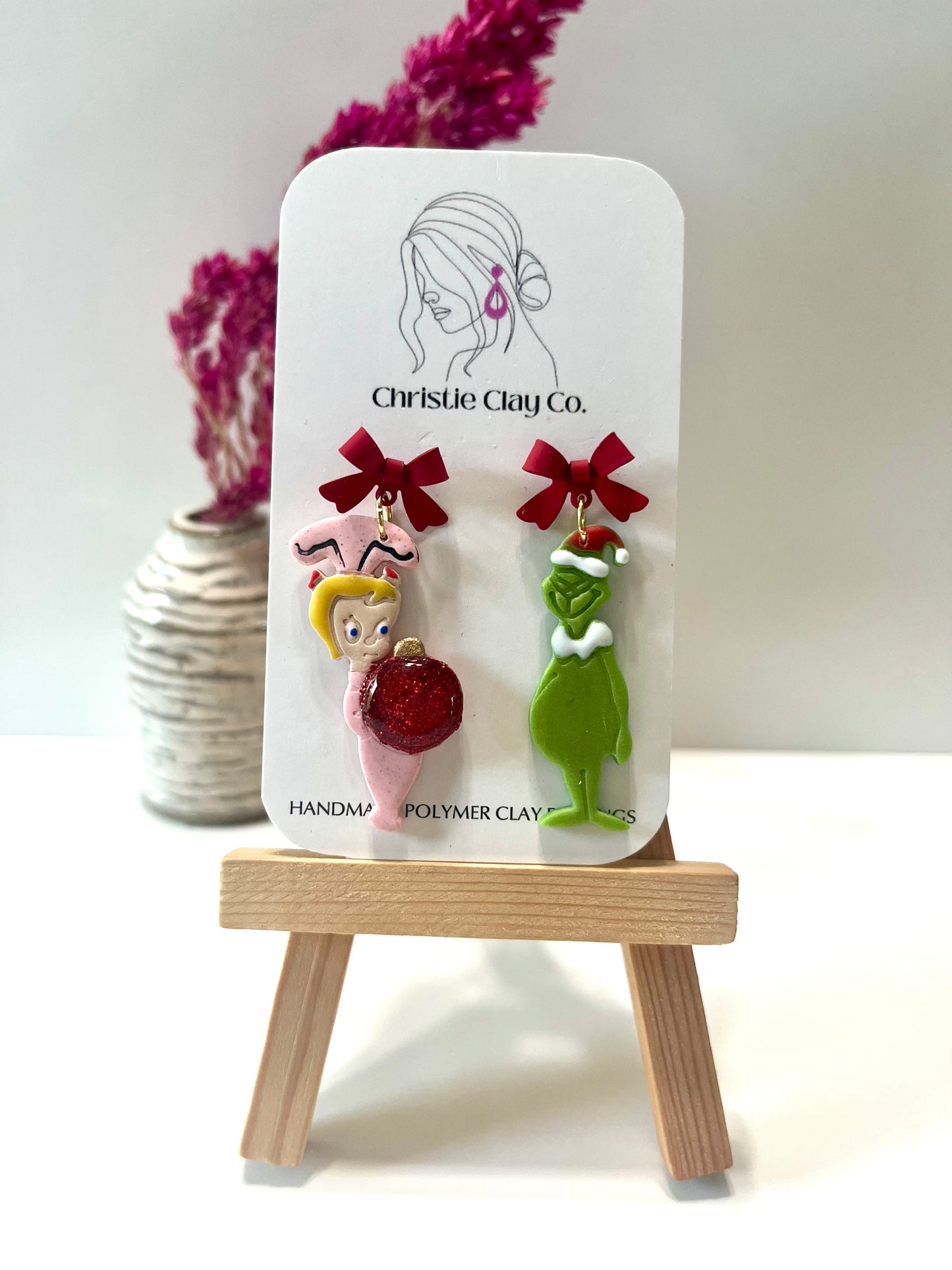 Christmas-Red bows and green meanie with little girl