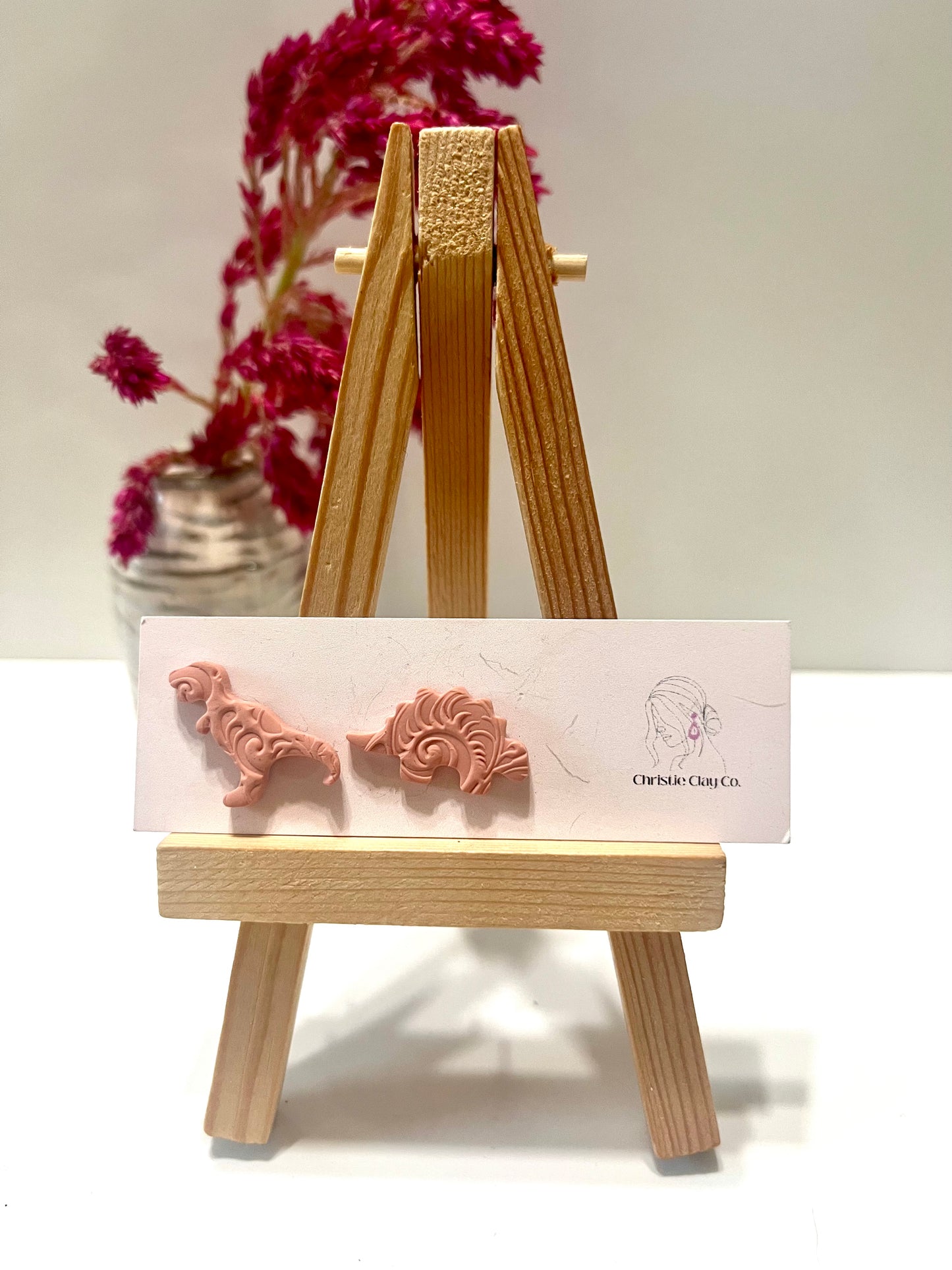 Dinos-Orange studs with imprint