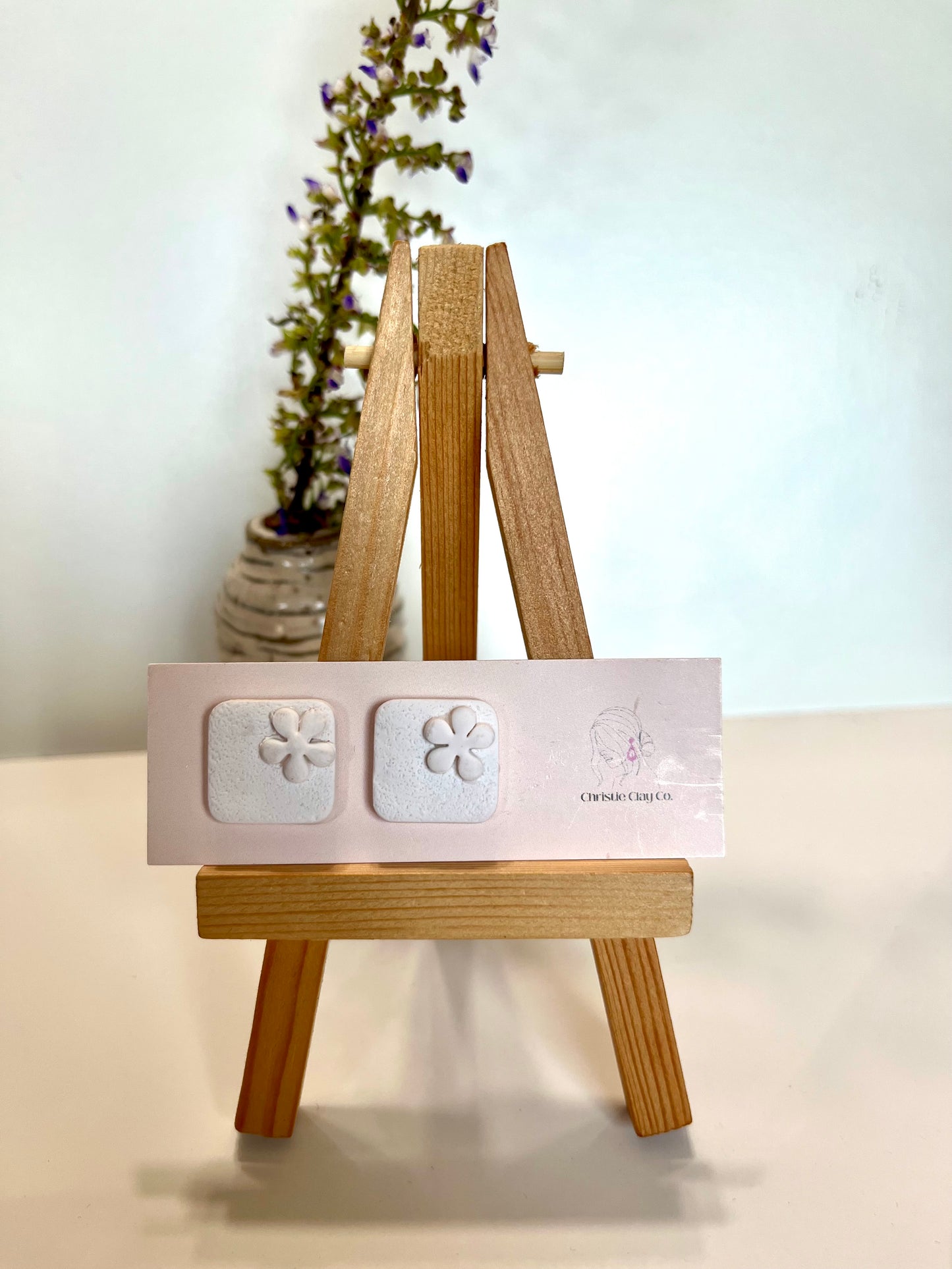 White square studs with flowers