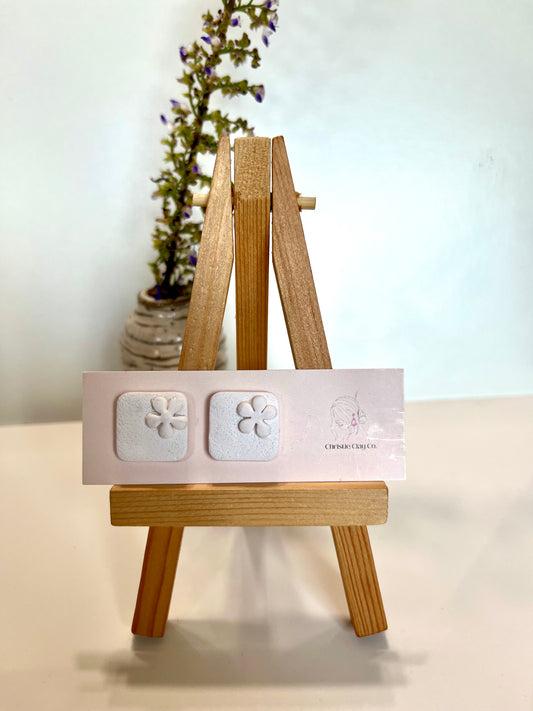 White square studs with flowers