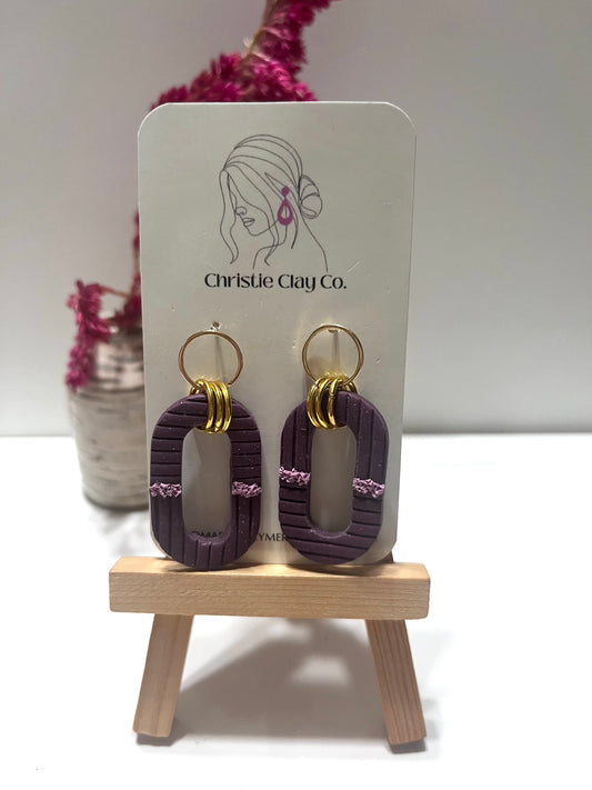 Simple purple oval cutout with gold accent