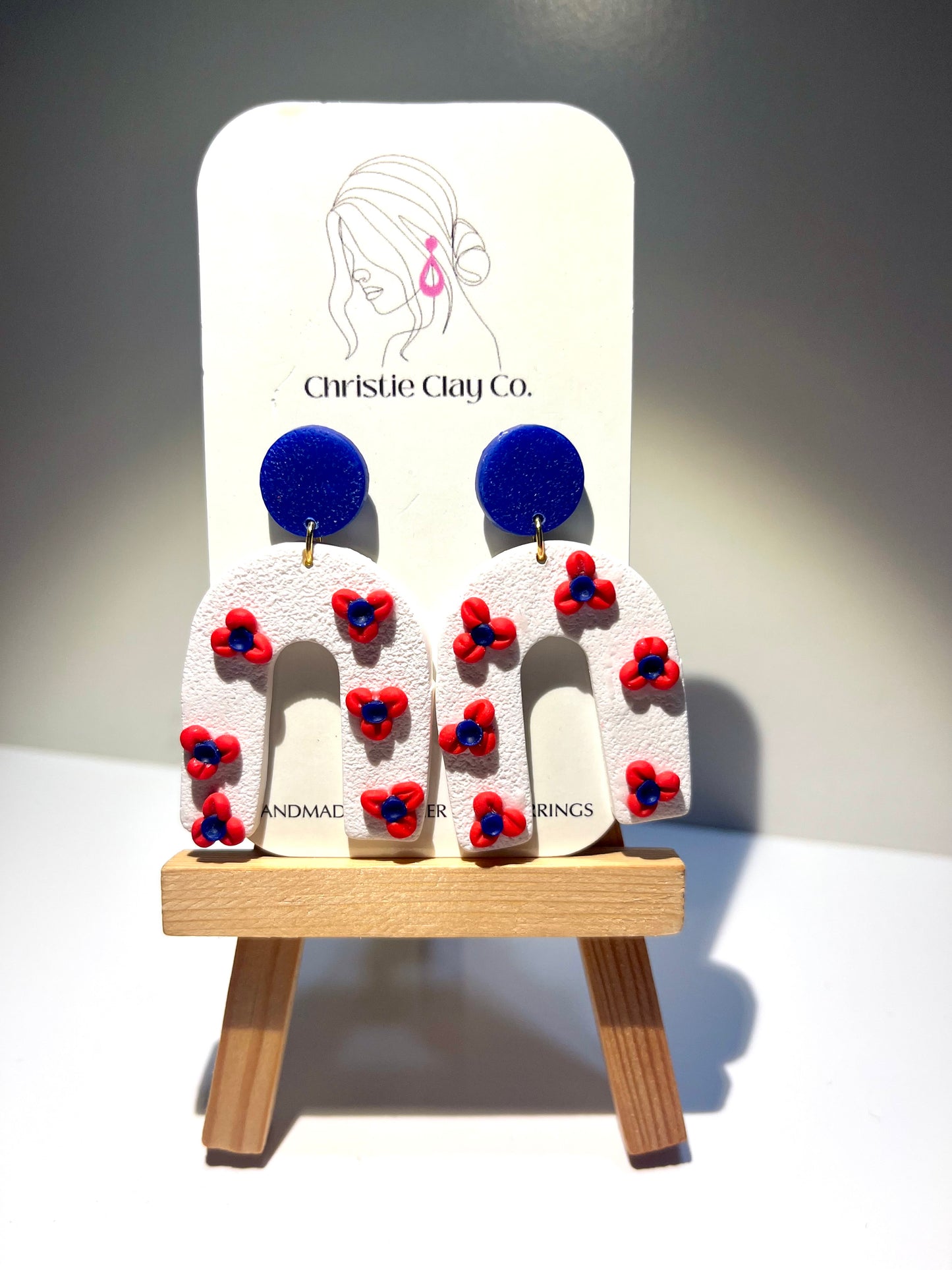 Red, White, & Blue-White half arch with flowers