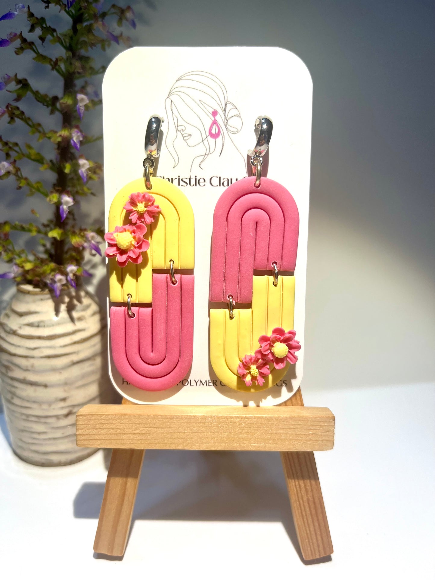 Pink and yellow symmetrical arch with flowers