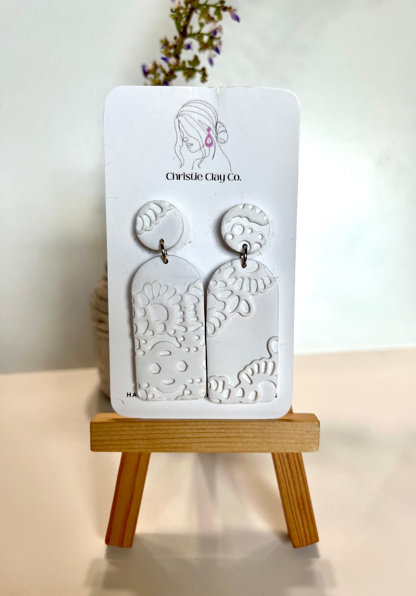 White tier dangle with imprint