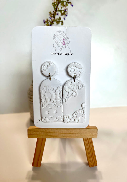 White tier dangle with imprint