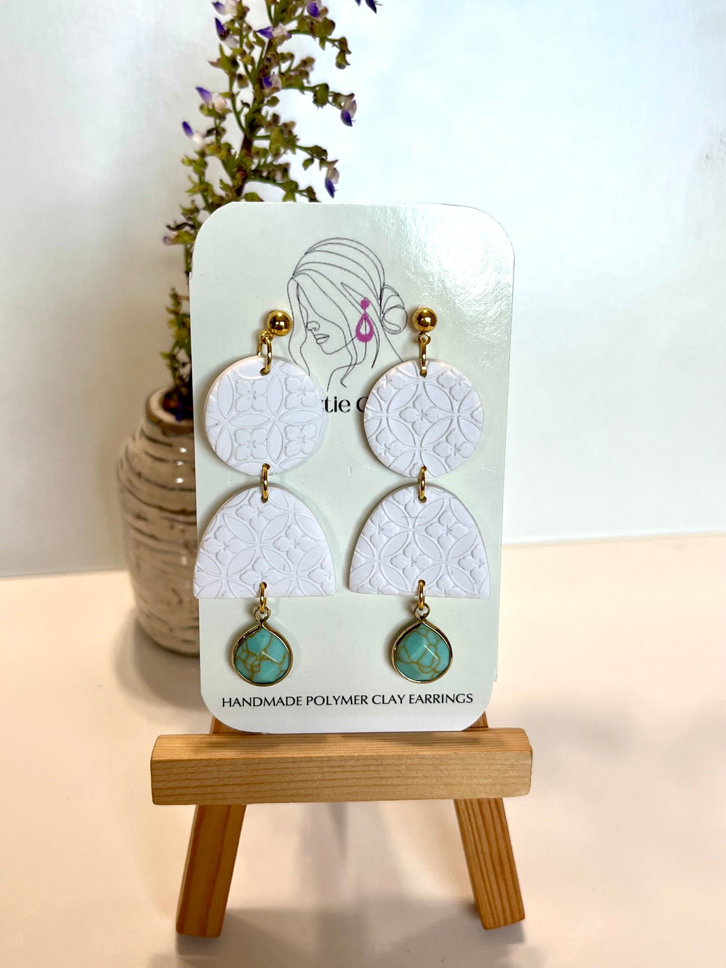 White three tier dangle with turquoise accent