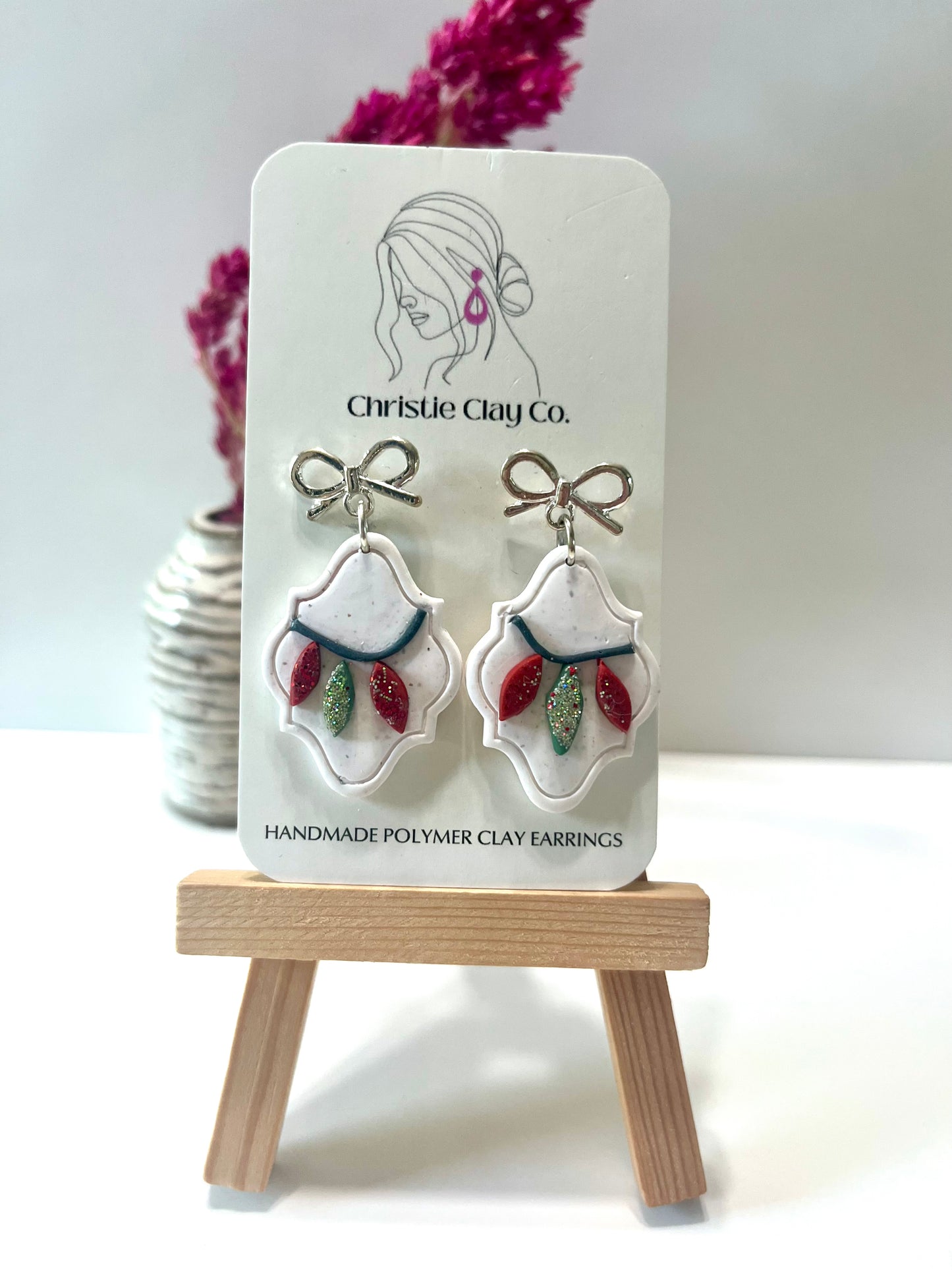 Christmas-Silver bows with Christmas lights on white cutout